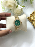Round green dial watch