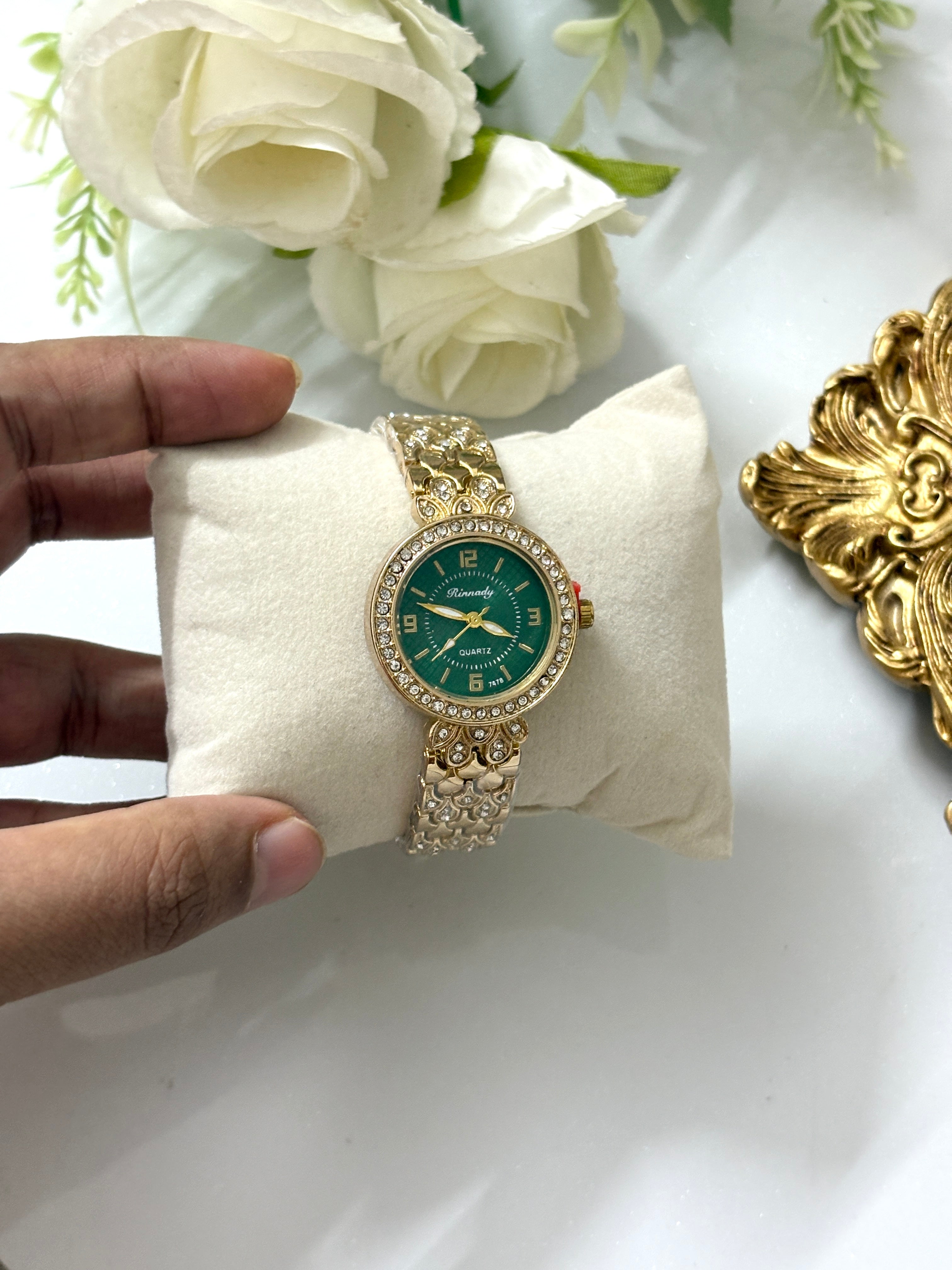 Round green dial watch