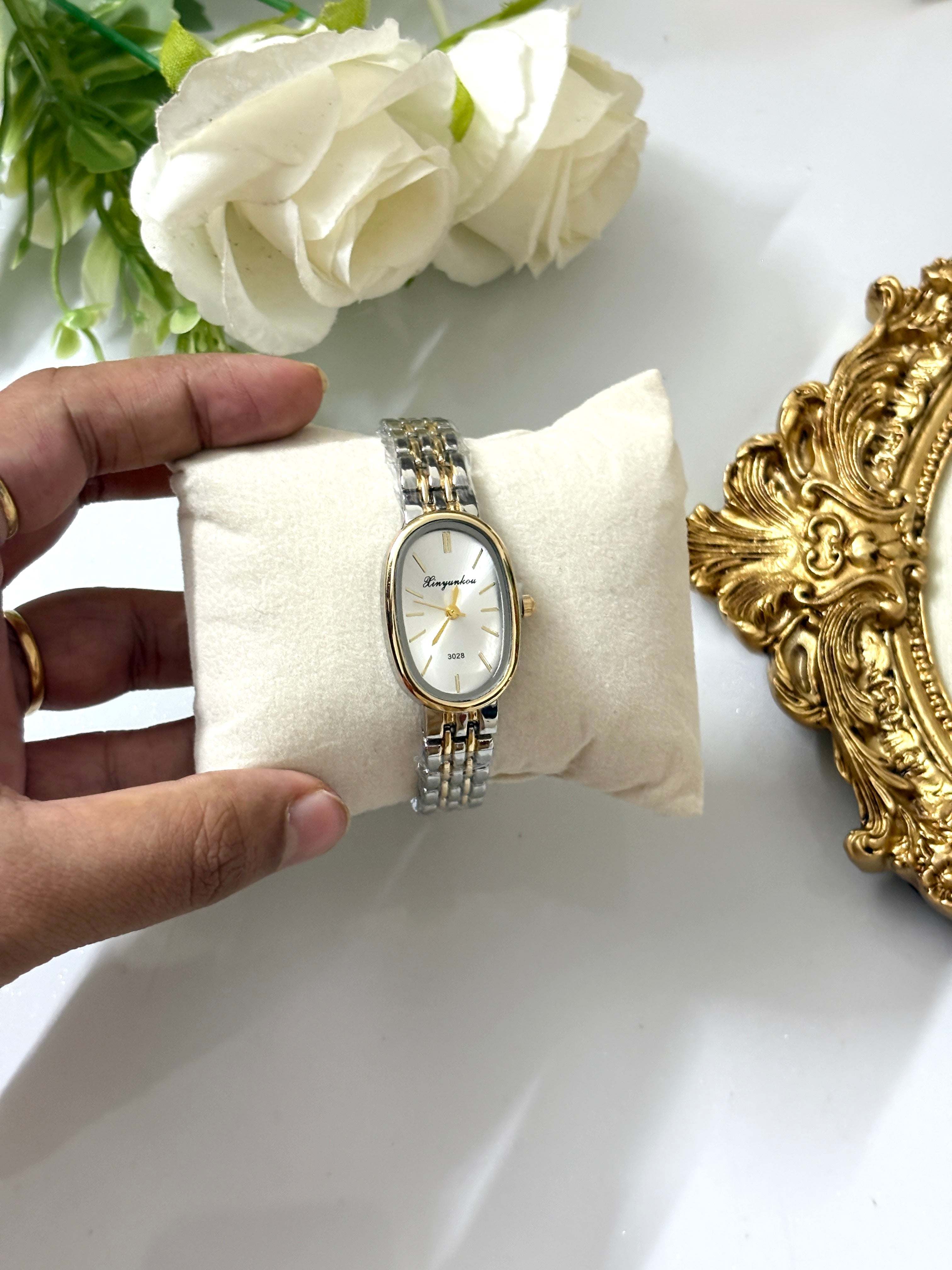 Elegant white dial watch